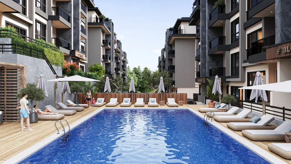 Serenity Town — havuz kenarı şezlong alanı